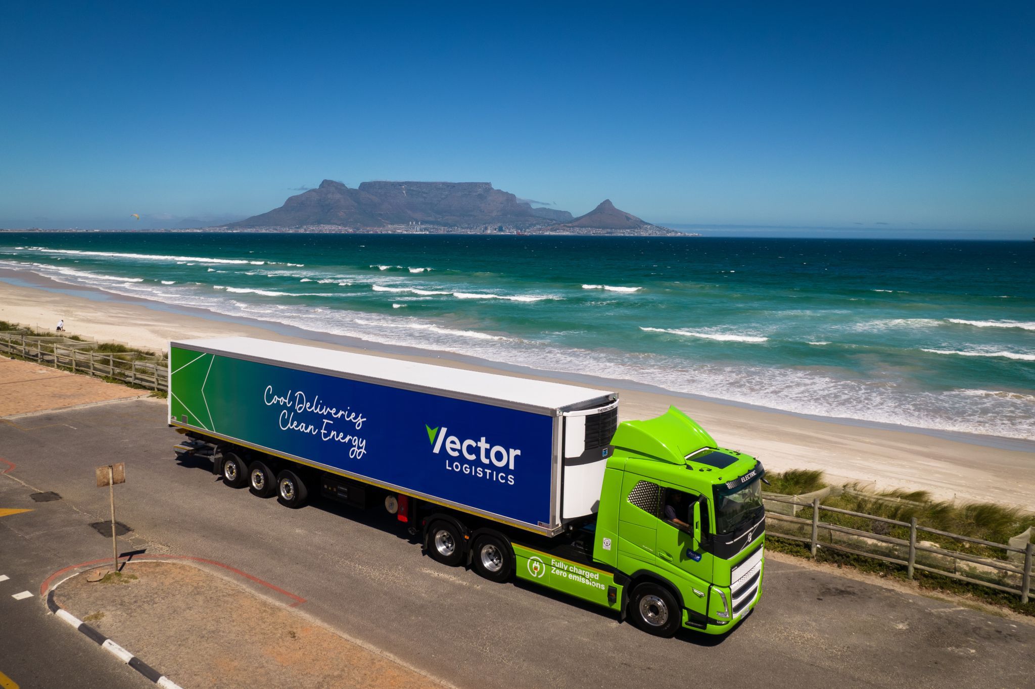 Vector logistics Volvo electric truck driving on a costal road