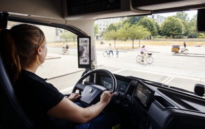 Professional truck driver at wheel using connected systems