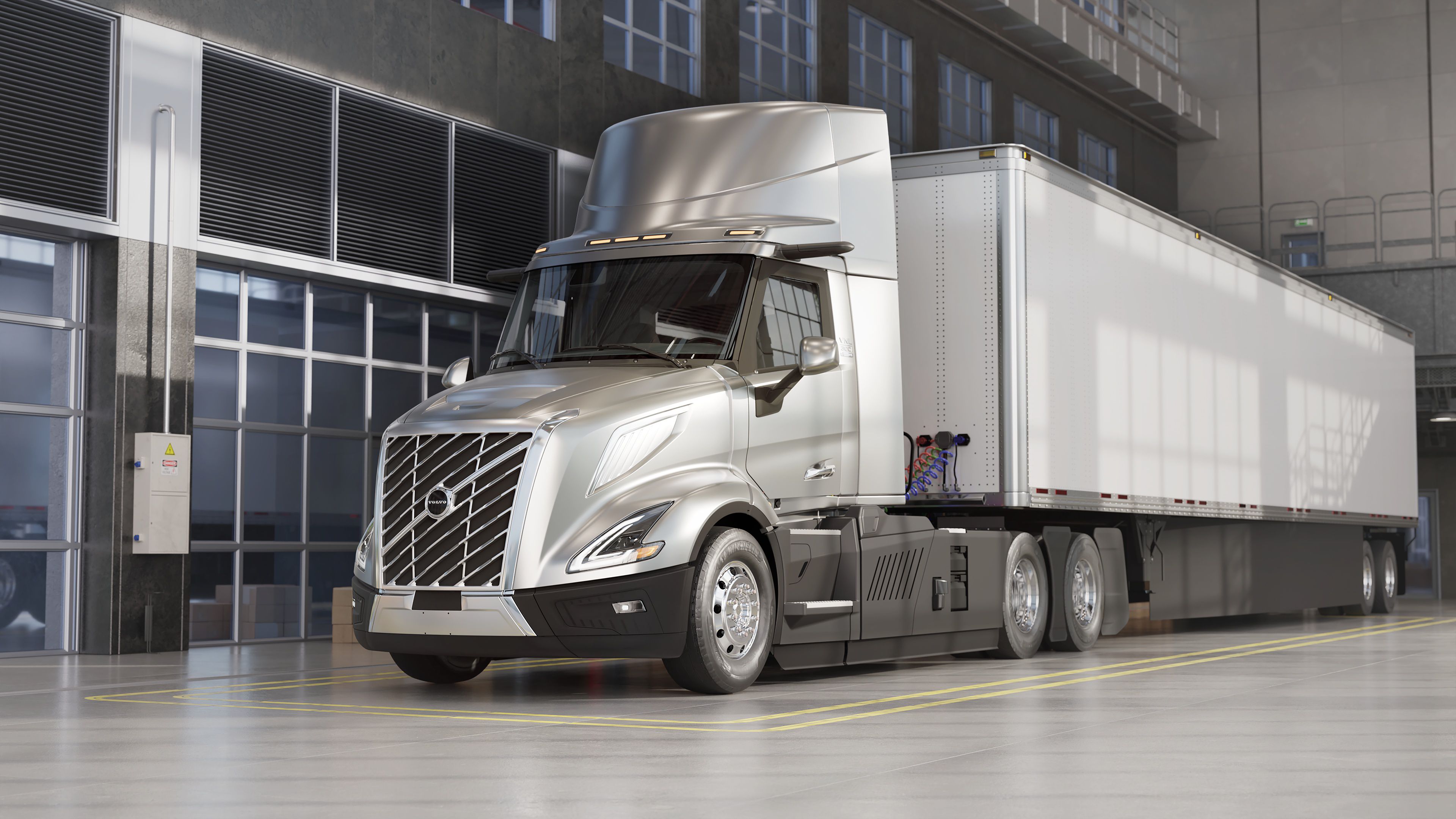 Gray VNL Electric in a trailer attached