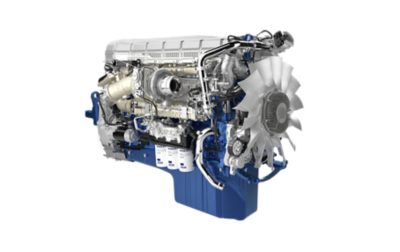 Close-up of a heavy-duty truck engine in a studio setting, highlighting large powertrain components and engine design.