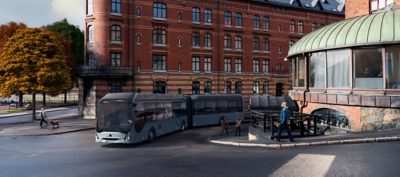 An articulated Volvo 7900 Electric driving through a crossing