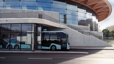 A Volvo 8900 Electric departing from an indoor bus stop