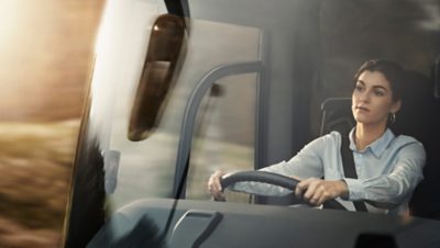  Female bus driver behind the steering wheel