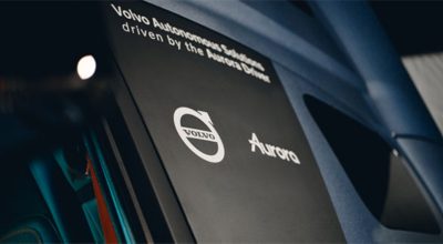 Text on the side of a driver cabinet saying Volvo Autonomous Solutions driven by the Aurora Driver