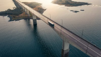 A Volvo 9700 Double Decker driving on bridge over water 