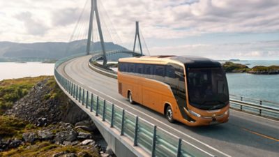 Side front view of a Volvo B13R – Marcopolo Paradiso G8 crossing a bridge in a coastal environment