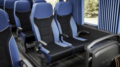 Black and blue passenger seats in a Volvo B13R – Marcopolo Paradiso G8