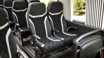 Black, grey and white passenger seats in a Volvo B13R – Marcopolo Paradiso G8 