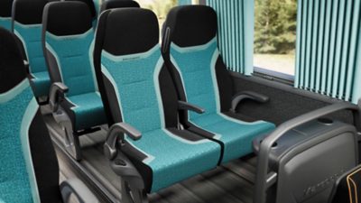 Black and turquoise passenger seats in a Volvo B13R – Marcopolo Paradiso G8
