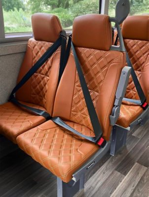 Two passenger seats with three-point seatbelts in a Volvo B8L DD – MCV Evoseti