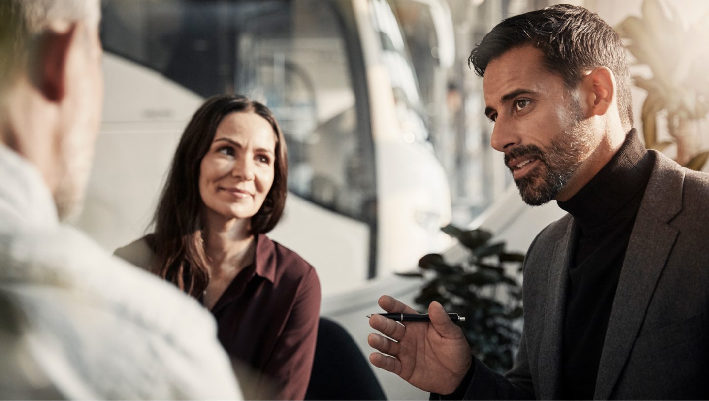 A business meeting regarding financial services for the purchase of a Volvo coach