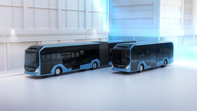 An illustration of a Volvo BZL Electric and a Volvo BZL Electric Articulated in a blue street zone