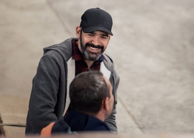 Man with hat smiling