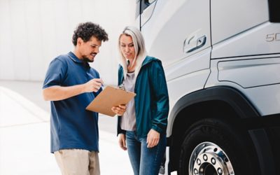 Two people working with checklist