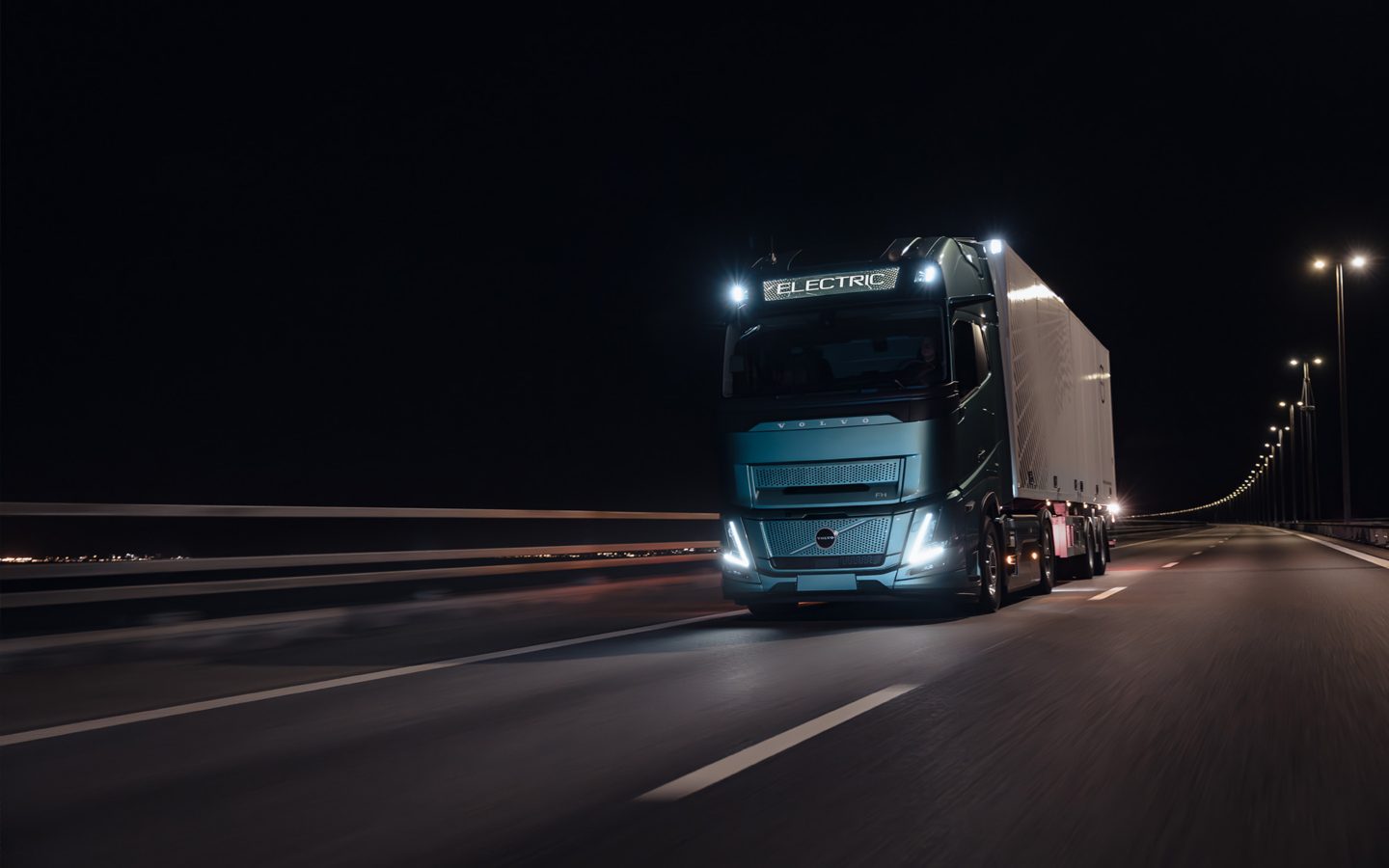 Volvo FH Aero driving in the dark, front and side view