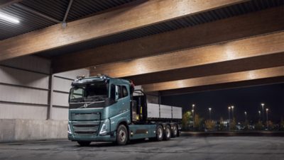 Man charging the Volvo FH Electric
