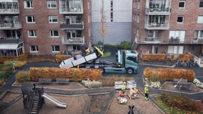 Volvo FH Electric truck with flatbed and crane. 