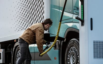 Man charging the Volvo FH Electric