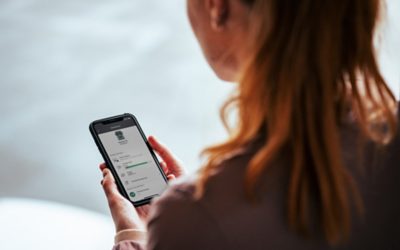 Woman holding and looking at a smartphone