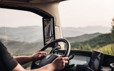 Truck interior. Hands on wheel