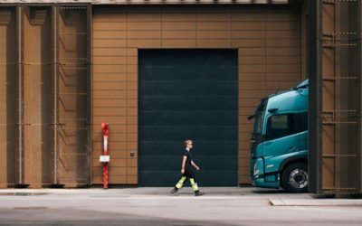 Woman walking by a building