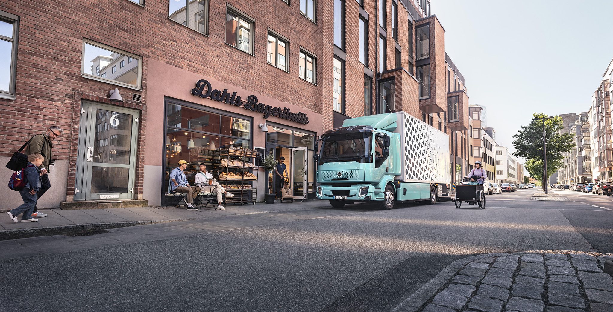 Volvo FL electric delivering to bakery shop in city environment