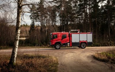 Volvo FMX crew cab driving on a gravel road