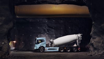 Volvo FMX Electric truck - concrete mixer in construction environment