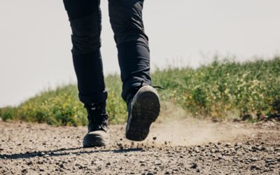 Man kicking up gravel