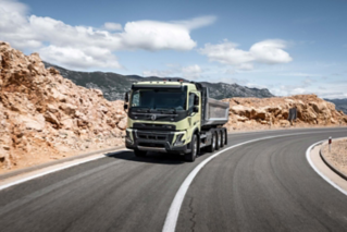 The Volvo FMX tridem with tipper on road.