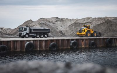 Volvo FMX driving by a harbor
