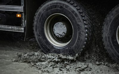 Volvo FMX driving through a puddle of water