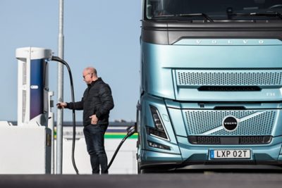 Person charging an electric truck