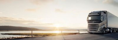 Volvo Trucking Adventure - Volvo FH in front of water and artic sunset