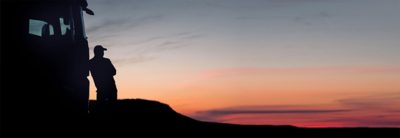 Volvo truck and truck driver in sunset