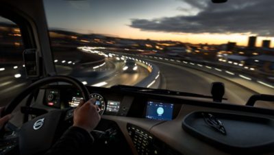 Volvo truck driving at night