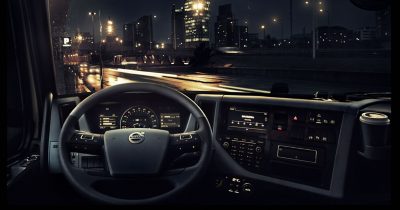 Steering wheel of a Volvo truck in the night time