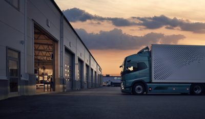 Volvo FM Electric cab next to a garage door