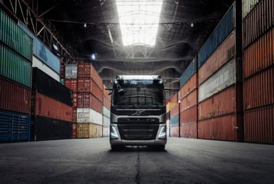 Volvo FM inside a building, surrounded by containers 